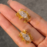 sculptural gold silk ribbon ring with east west diamond