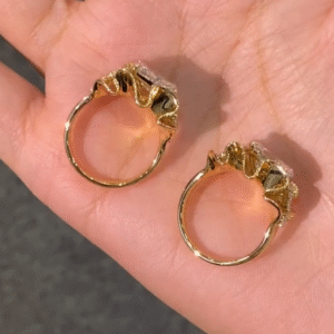 sculptural gold silk ribbon ring with east west diamond