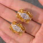sculptural gold silk ribbon ring with east west diamond