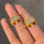 sculptural gold silk ribbon ring with east west diamond
