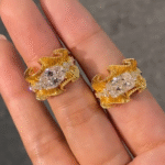 sculptural gold silk ribbon ring with east west diamond