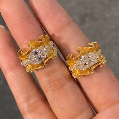 sculptural gold silk ribbon ring with east west diamond