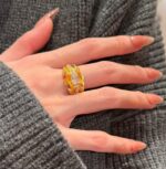 sculptural gold silk ribbon ring with east west diamond