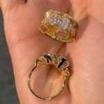 sculptural gold silk ribbon ring with east west diamond