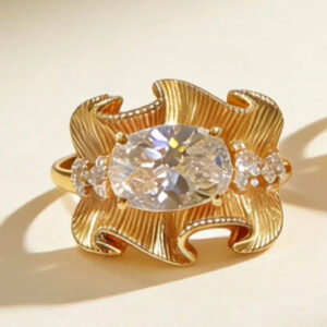 sculptural gold silk ribbon ring with east west radiant diamond52