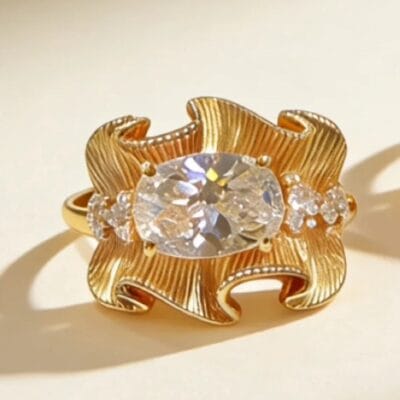 sculptural gold silk ribbon ring with east west radiant diamond52