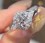 three stone lab diamond ring – round center with marquise side stones and pavé halo