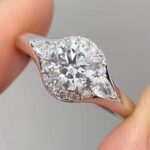 three stone lab diamond ring – round center with marquise side stones and pavé halo