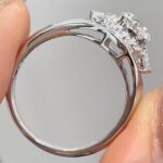 three stone lab diamond ring – round center with marquise side stones and pavé halo